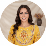 Circular portrait of influencer Noor Joudi, smiling, wearing the MALIKA embroidered dress with oriental-inspired embroidery.